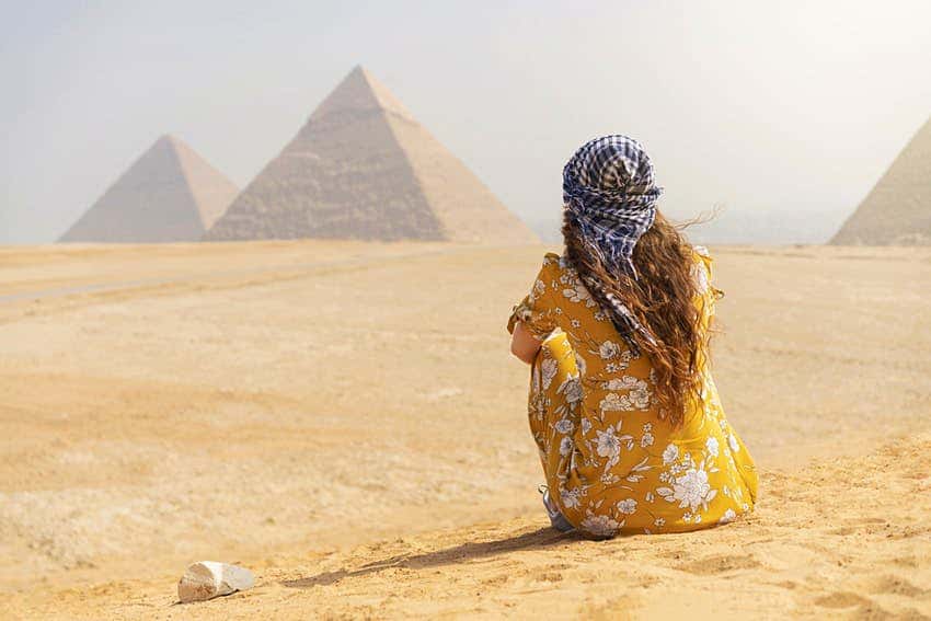 woman and pyramids